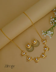 Celestial jewelry set with pearl and half moon pendant necklace and matching earrings.