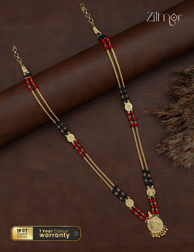 Full view of layered Lakshmi coin long necklace with red and dark green beads