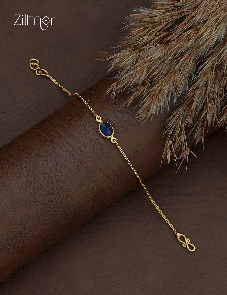 Navy blue oval stone on delicate gold plated bracelet chain