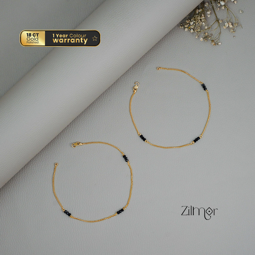 KT1011131 - Gold Toned Black bead pair Anklet