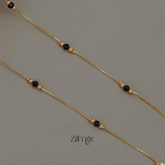 KT1011338 - Gold Toned Black bead pair Anklet