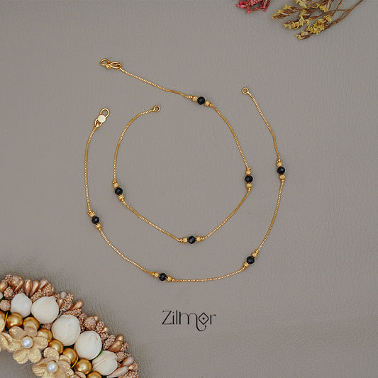 KT1011338 - Gold Toned Black bead pair Anklet