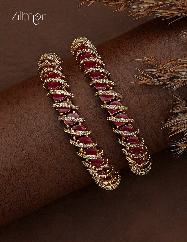 AD Stone Bangle Pair worn on wrist – ruby red marquise stones with gold micro-pavé, front view