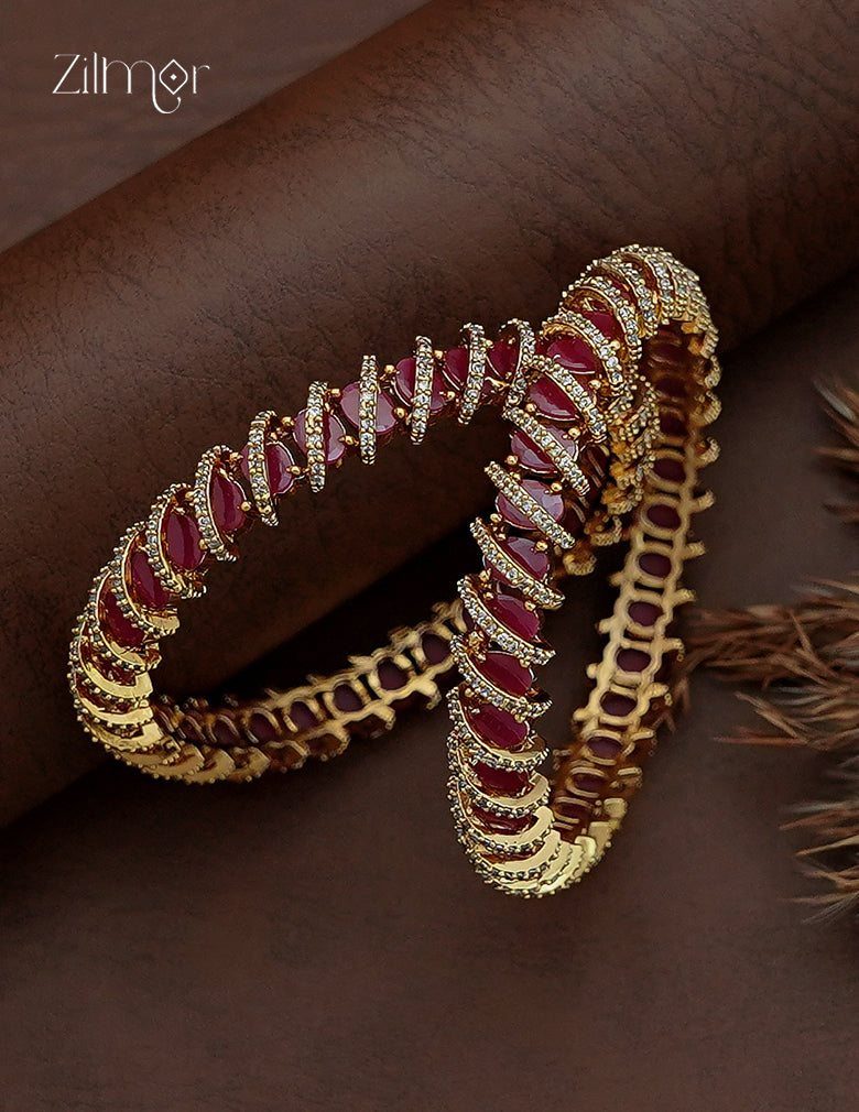 AD Stone Bangle Pair flat lay – ruby red marquise stones with gold tone base, pair view