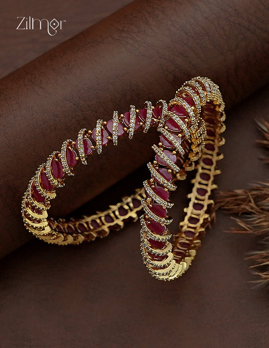 AD Stone Bangle Pair flat lay – ruby red marquise stones with gold tone base, pair view