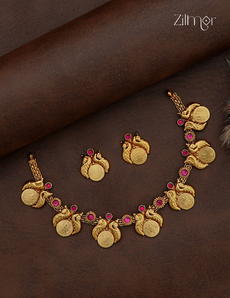 Antique gold Lakshmi coin necklace and earring set with peacock motifs and ruby pink stones by Zilmor