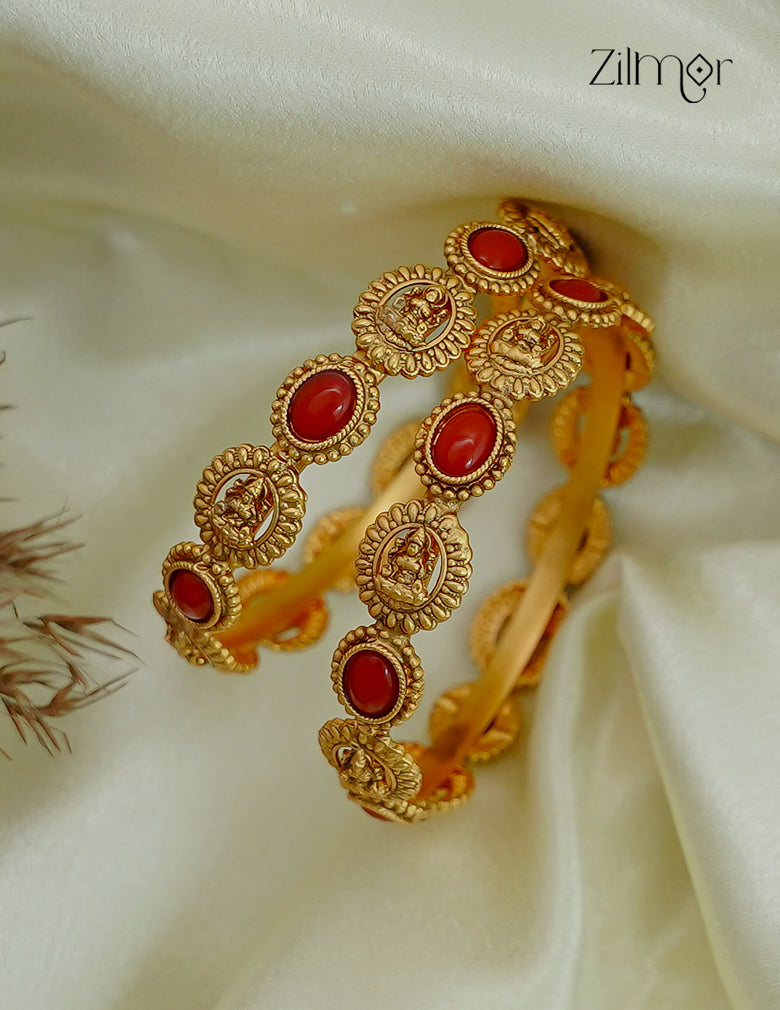 Antique Gold Lakshmi Coral Bangle Pair - Lifestyle Shot on Cream Silk Fabric