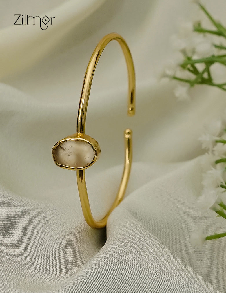 Gold plated adjustable bangle with natural raw stone, cream tone