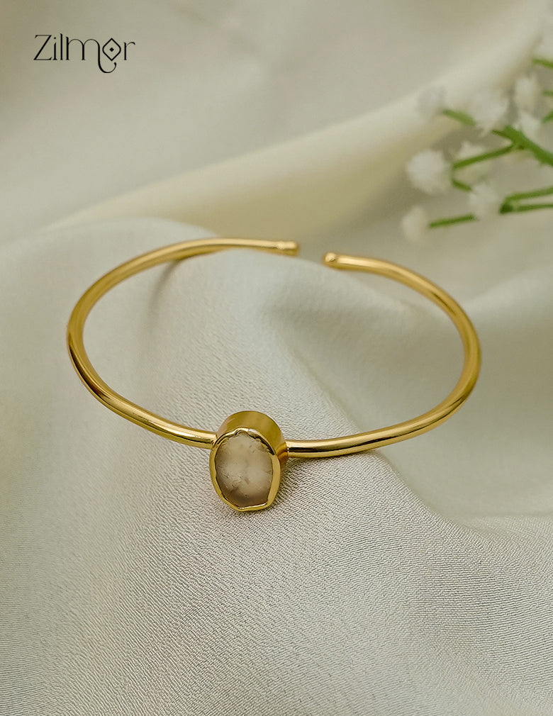Gold plated adjustable bangle with natural raw stone, dark smoky tone