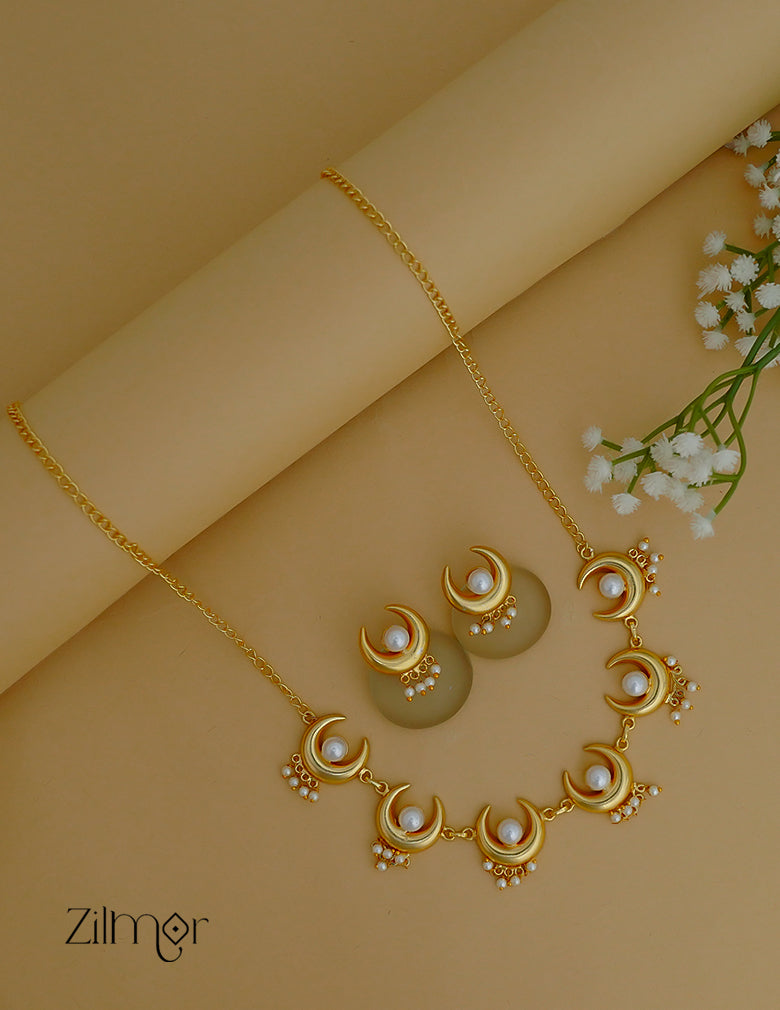 Celestial jewelry set with pearl and half moon pendant necklace and matching earrings.