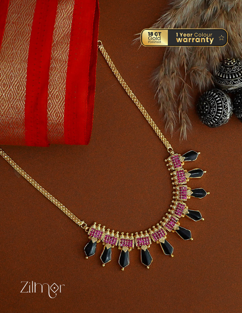 Gold Plated Nagapadam necklace with shimmering ad stone embellishments.