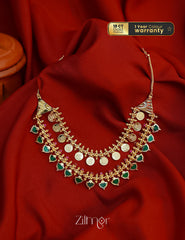 Multi-layer gold tone bridal choker necklace with Lakshmi coin and leaf design.