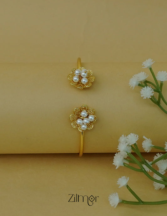 Gold-tone floral design adjustable bangle with pearl cluster embellishments