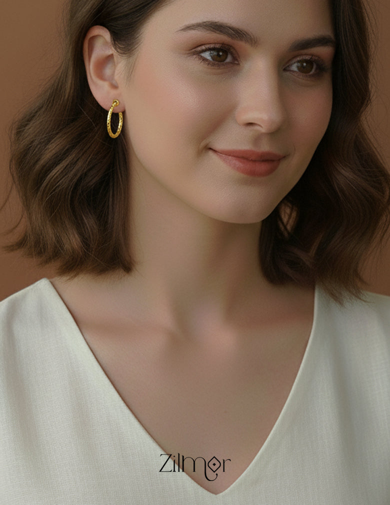 Close-up of the smooth, seamless closure on the minimal hoop earrings