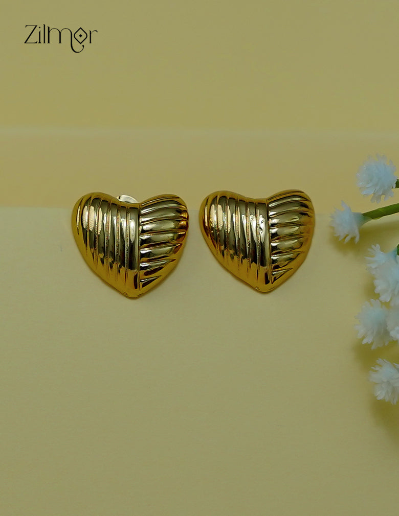 Close-up of the golden heart-shaped anti-tarnish stud earrings