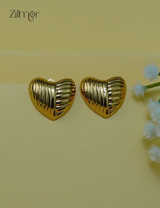 Close-up of the golden heart-shaped anti-tarnish stud earrings